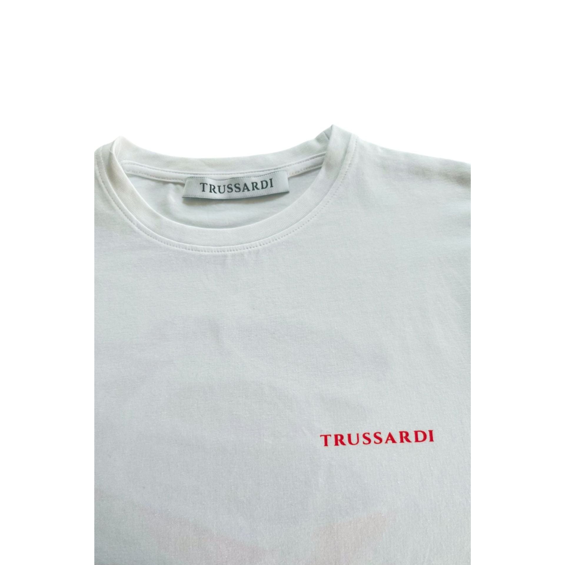 White Trussardi beachwear top by Jag Couture London, featuring stylish design and comfortable fit for beach or casual wear.