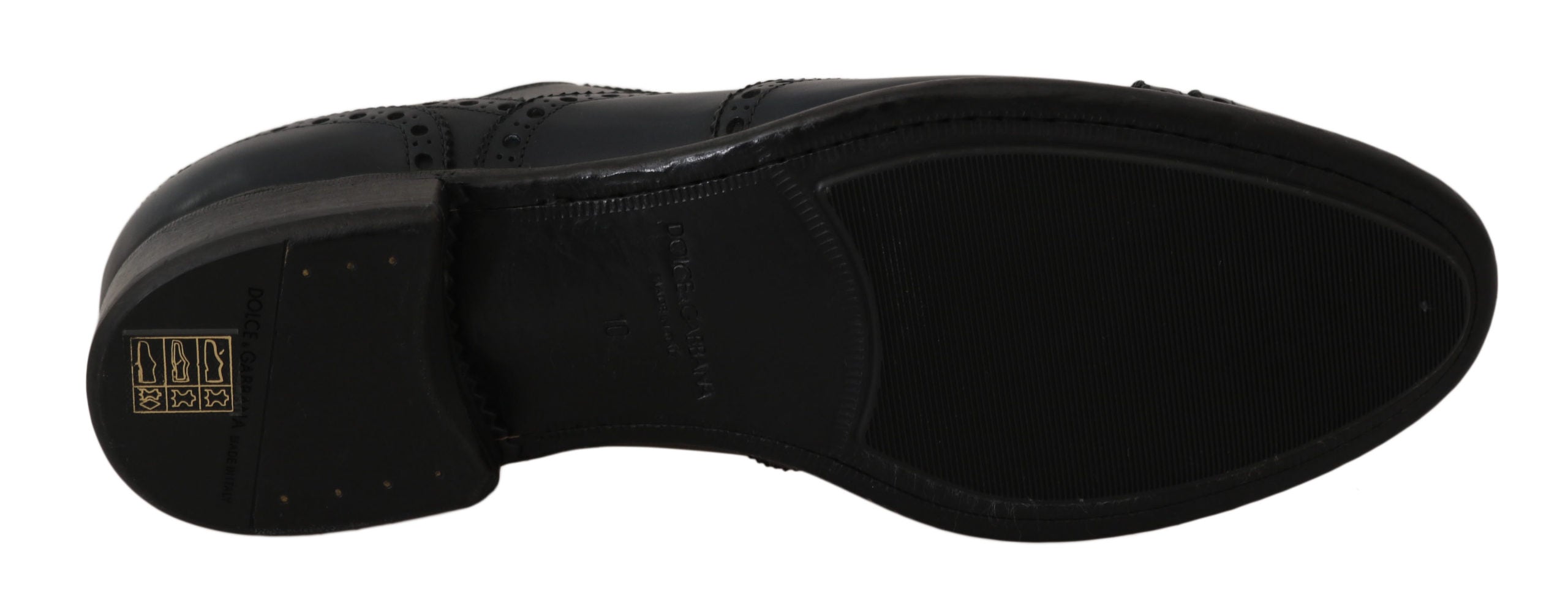 Dark blue leather wingtip Oxford dress shoes by Dolce & Gabbana with brogue detailing and sleek polished finish.