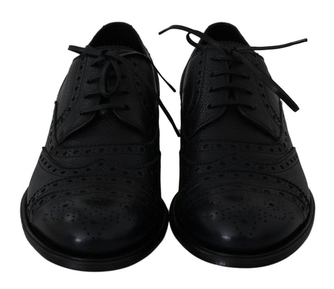 Blue leather wingtip Oxford dress shoes by Dolce & Gabbana with brogue detailing and classic lace-up style.