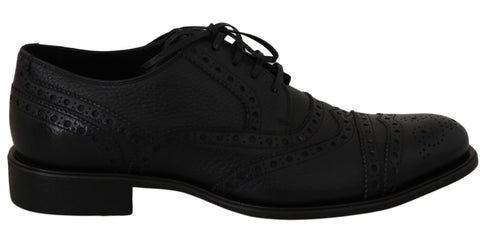 Blue leather wingtip Oxford dress shoes by Dolce & Gabbana, featuring classic brogue detailing and polished finish.