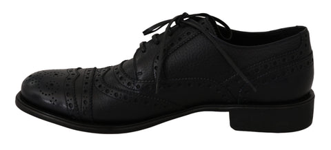 Blue leather wingtip Oxford dress shoes by Dolce & Gabbana, featuring classic brogue detailing and polished finish.