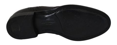Blue leather wingtip oxford dress shoes by Dolce & Gabbana with detailed brogue accents and classic lace-up design.