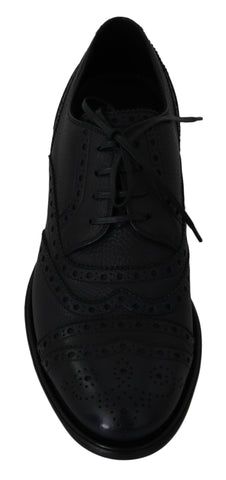 Blue leather wingtip oxford dress shoes by Dolce & Gabbana, featuring classic brogue detailing and polished finish.