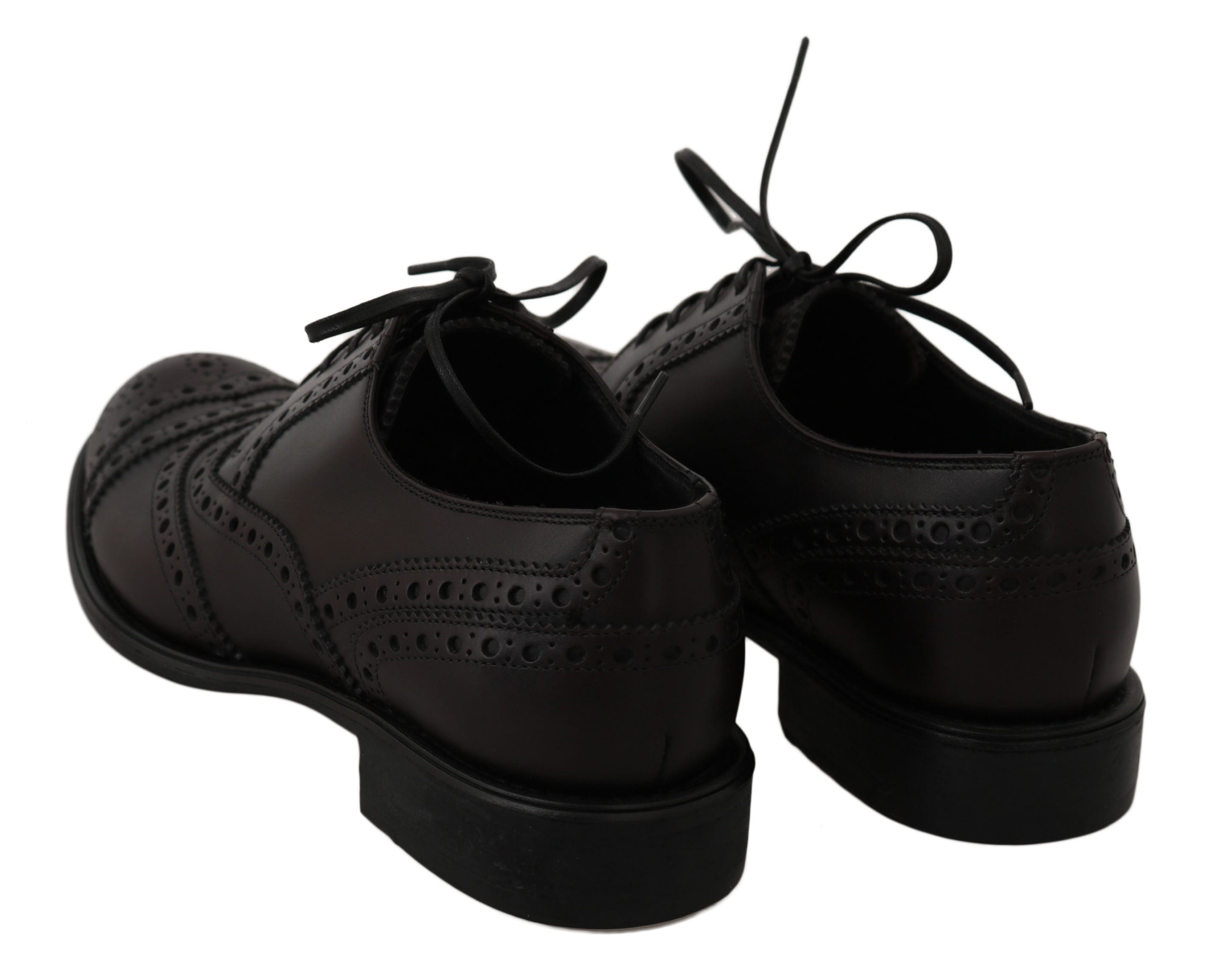 Black leather wingtip oxford dress shoes by Dolce & Gabbana, featuring classic brogue detailing and sleek lace-up design.