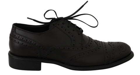 Black leather wingtip Oxford dress shoes by Dolce & Gabbana, featuring classic brogue detailing and polished finish.