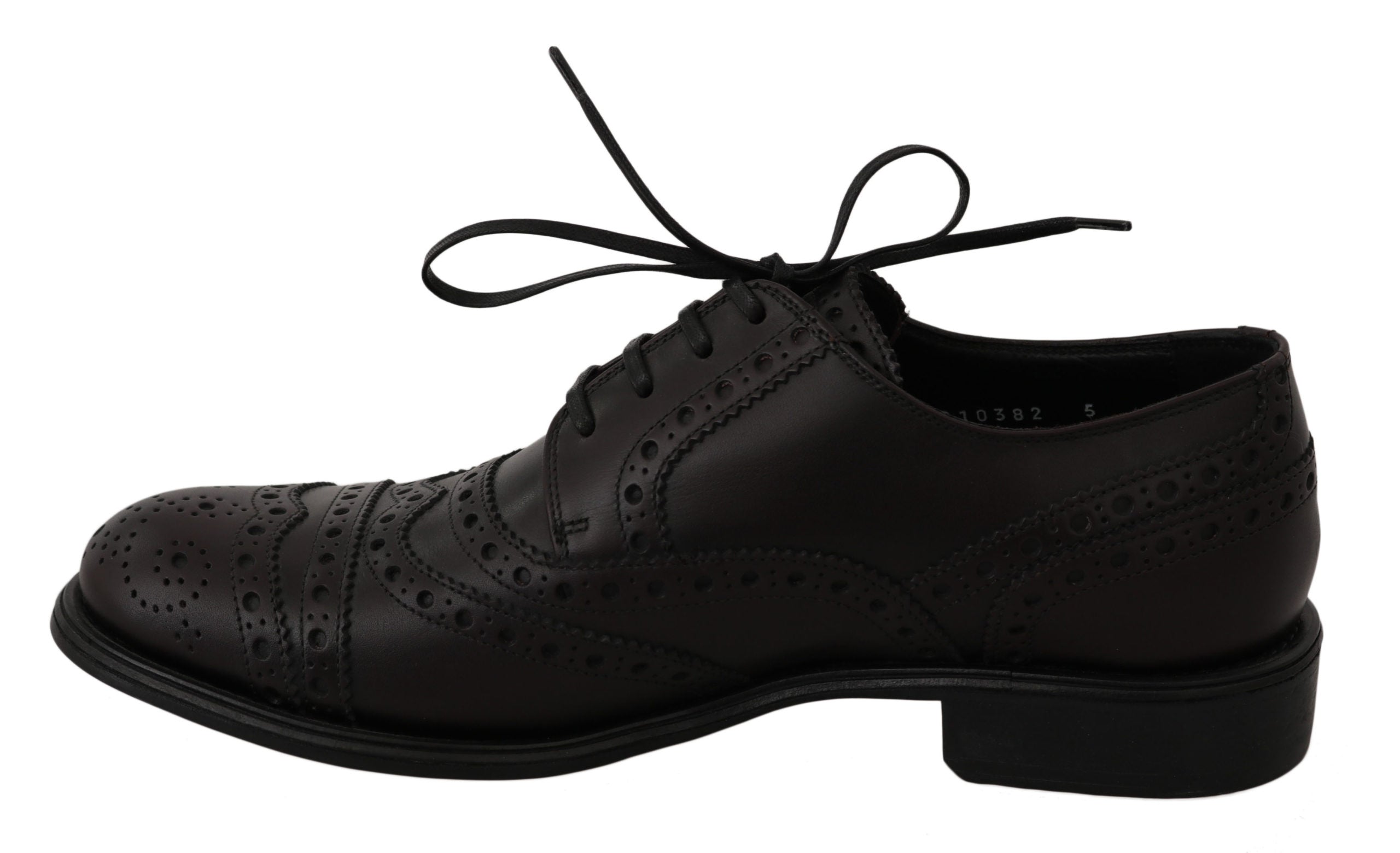 Black leather wingtip Oxford dress shoes by Dolce & Gabbana featuring classic brogue detailing and sleek polished finish.