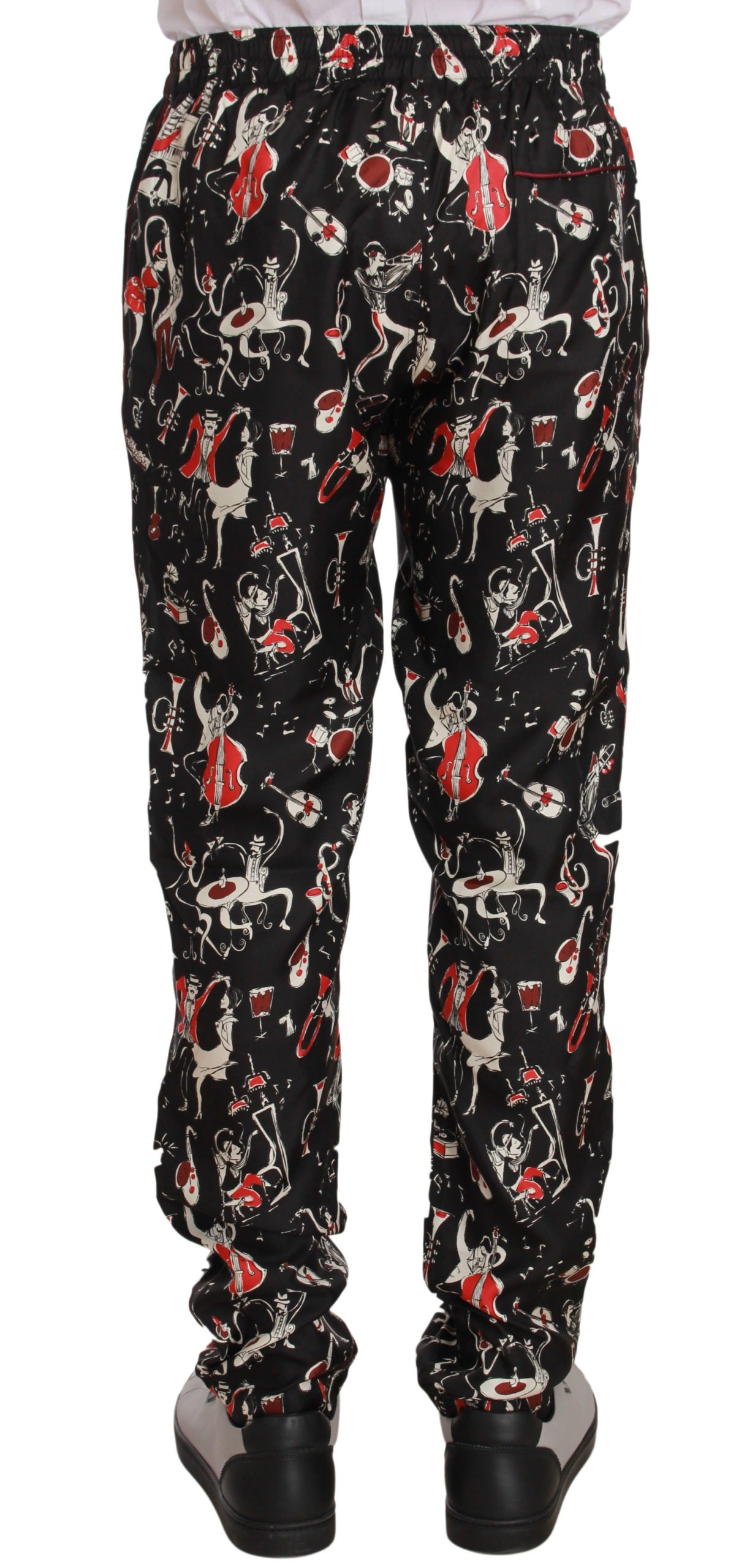 Red sleepwear pants with musical instrument print by Dolce & Gabbana, featuring a comfortable relaxed fit and vibrant design.