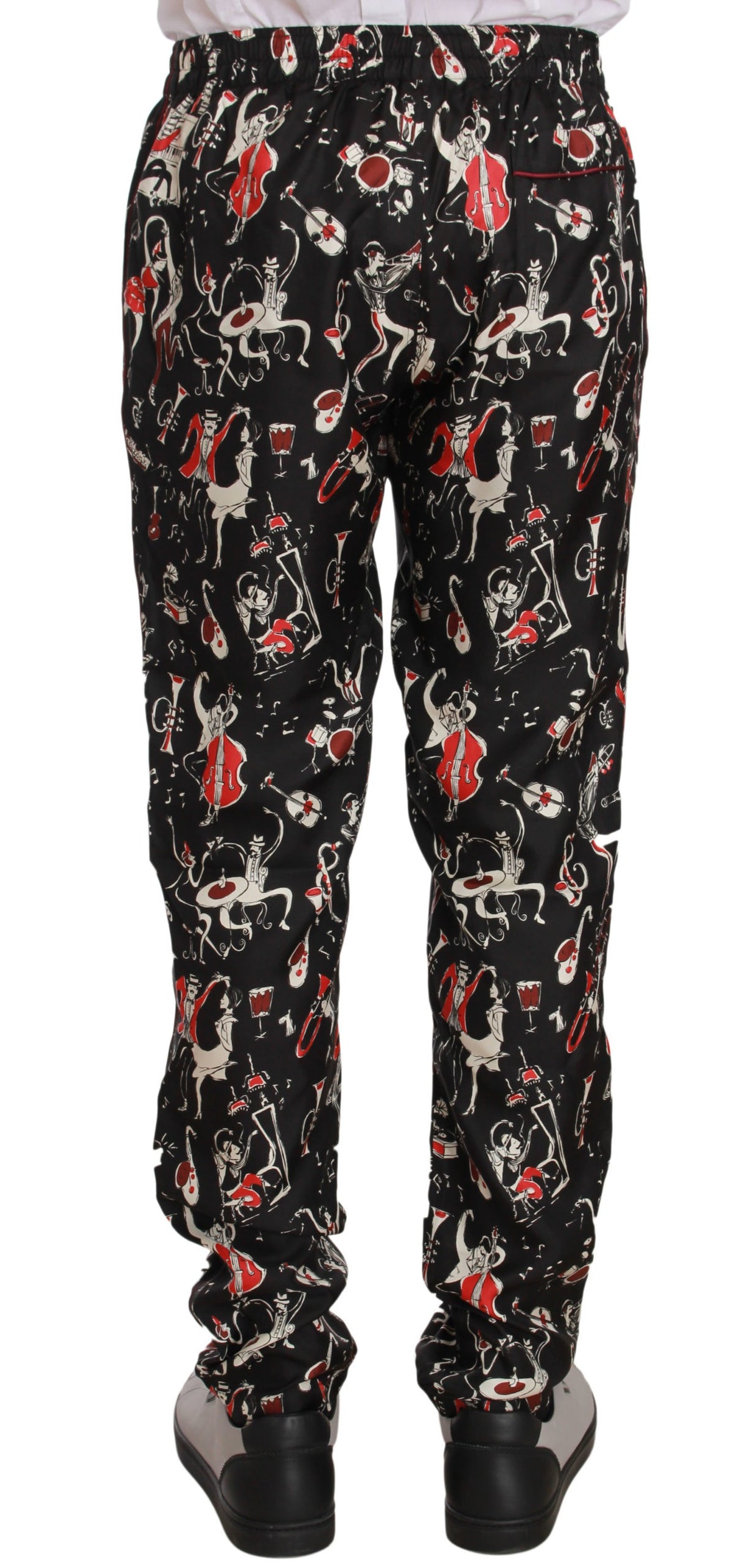 Red sleepwear pants with musical instrument print by Dolce & Gabbana, featuring a comfortable relaxed fit and vibrant design.