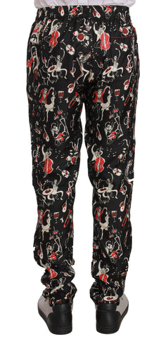 Red sleepwear pants with musical instrument print by Dolce & Gabbana, featuring a comfortable relaxed fit and vibrant design.