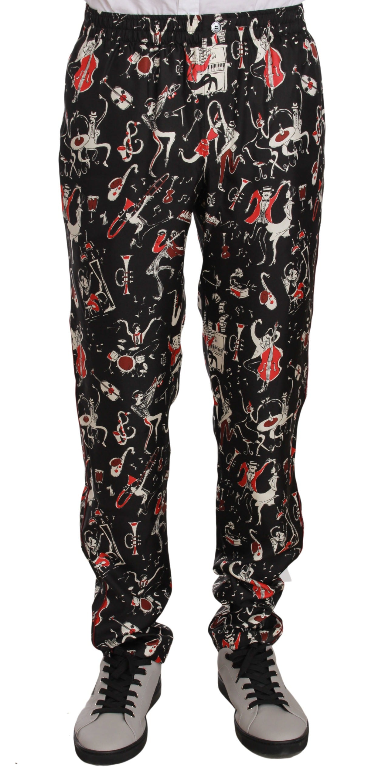 Red sleepwear pants with musical instrument print by Dolce & Gabbana, featuring comfortable fabric and detailed musical design.