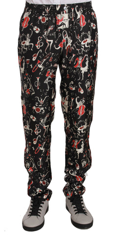 Red sleepwear pants with musical instrument print by Dolce & Gabbana, featuring comfortable fabric and detailed musical design.
