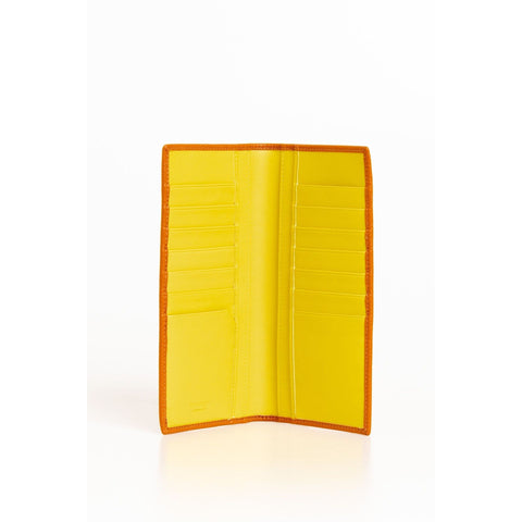 Yellow leather handbag by Trussardi, showcased in natural light with smooth texture and structured shape.