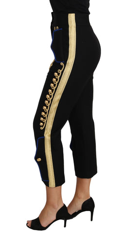 Black Dolce & Gabbana military embellished dress pants with gold accents, tailored fit, and detailed decorative elements.