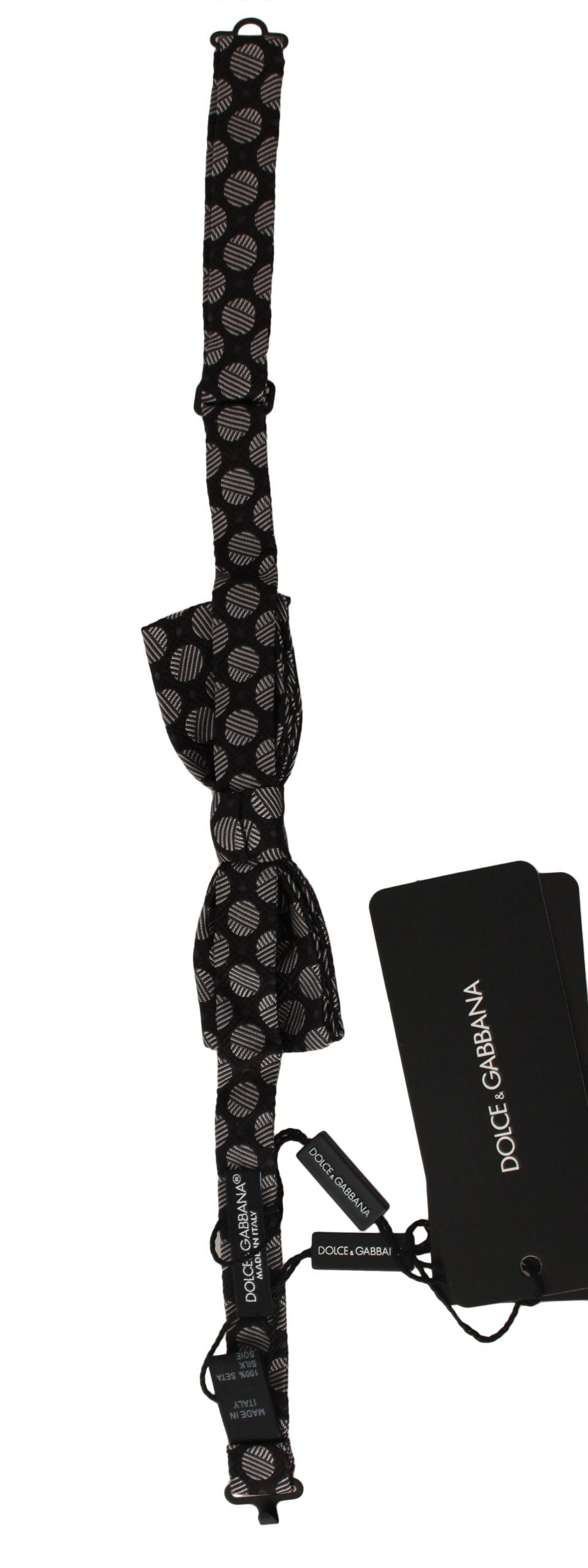 Brown silk polka dot jacquard men's bow tie by Dolce & Gabbana, featuring a classic polka dot pattern and elegant design.