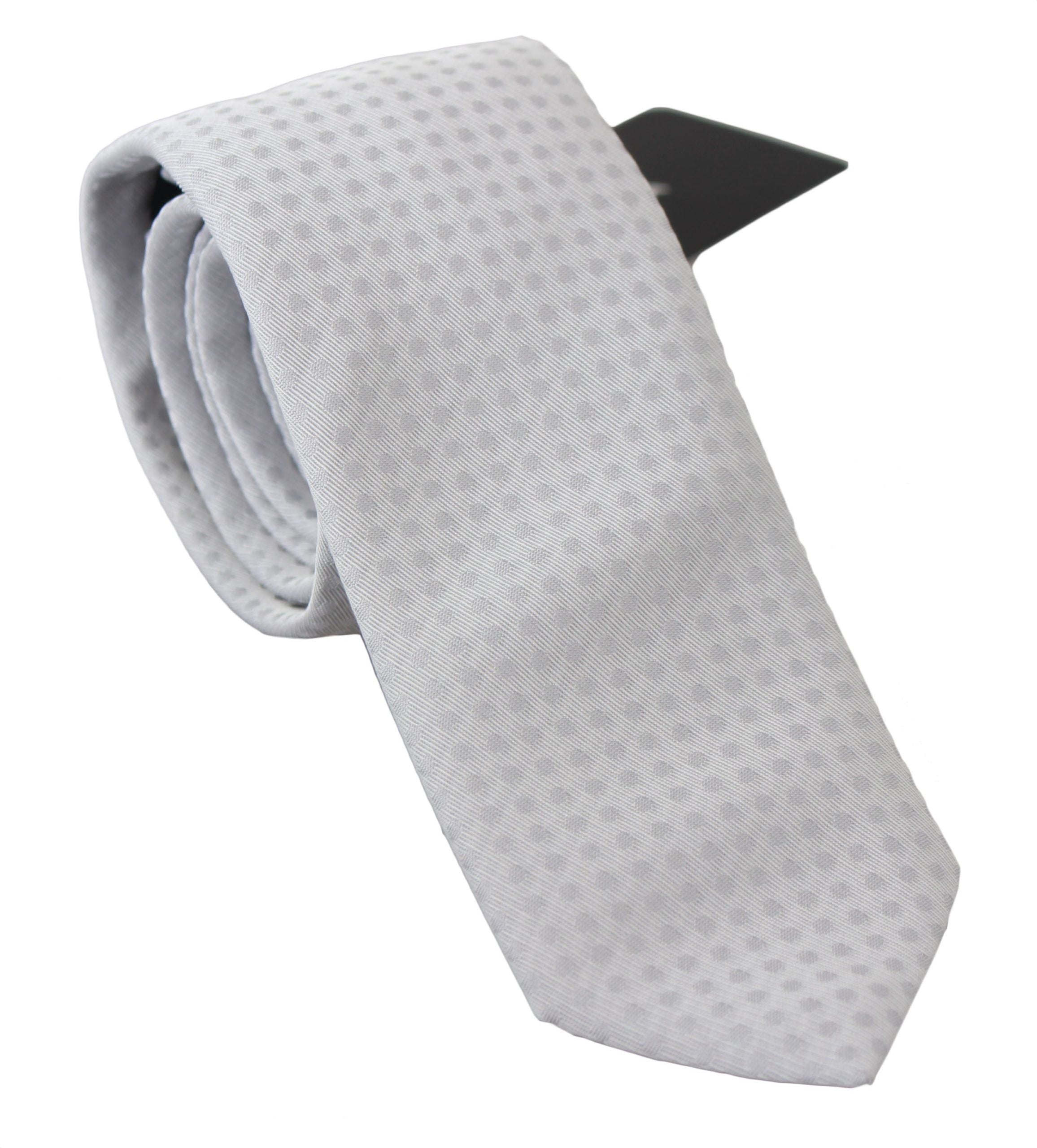 White patterned classic men's slim necktie by Dolce & Gabbana, featuring a stylish, sophisticated design with detailed pattern.