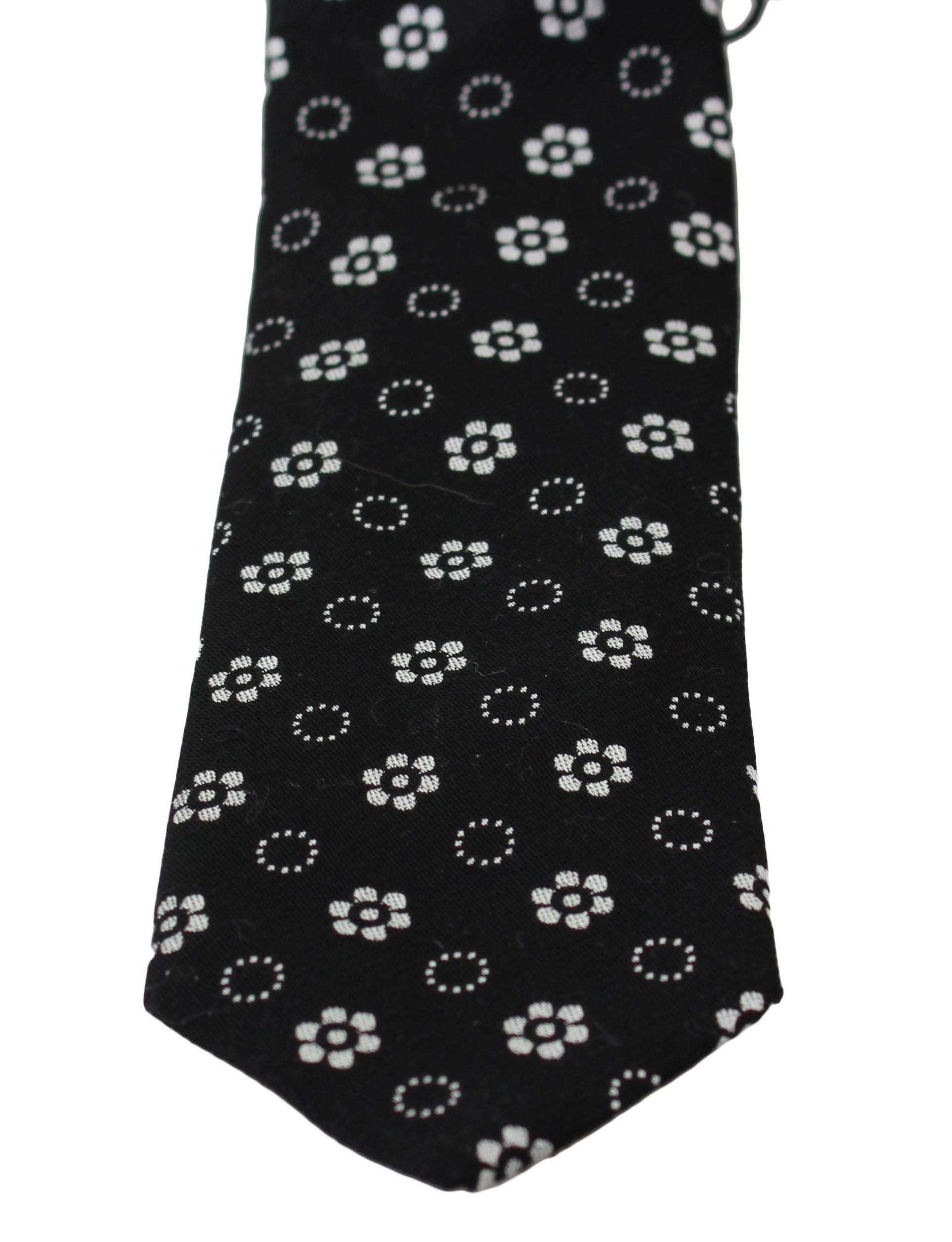 Black 100% silk floral print classic tie by Dolce & Gabbana, featuring elegant floral patterns and a sleek silk finish.