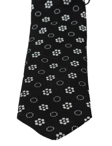 Black 100% silk floral print classic tie by Dolce & Gabbana, featuring elegant floral patterns and a sleek silk finish.