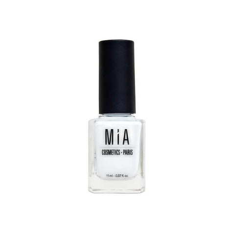 Jag Couture London - New York Mía Cosmetics Frost White nail polish bottle with white cap, close-up shot.