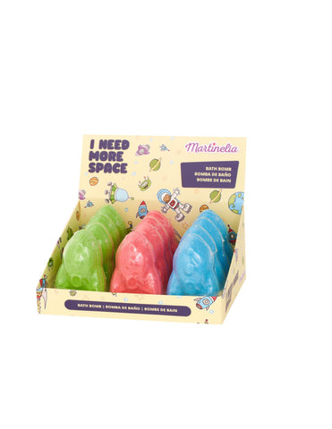 Martinelia I Need More Space Rocket bath bomb by Jag Couture London, shaped like a rocket, in vibrant colors, set for a relaxing bath.