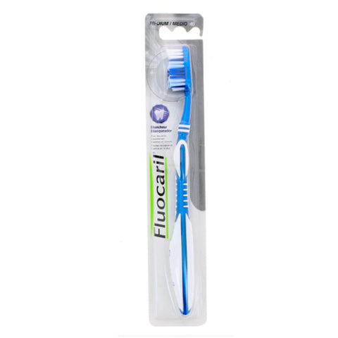 Jag Couture London - New York Fluocaril Toothbrush Whitening 40 Medium with blue and white handle and bristles, designed for effective teeth whitening