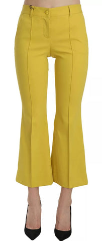 Yellow flared bootcut cotton capri pants by Dolce & Gabbana, showing a close-up of the stylish, fitted waist and flared hem.