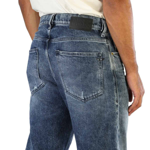 Diesel D-MACS men's jeans from Jag Couture London featuring classic fit, dark denim, and stylish design details.