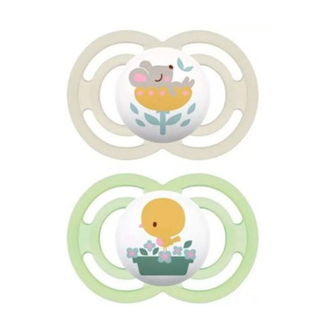 Two Mam Perfect +6M silicone pacifiers in yellow and green, designed for babies over 6 months, by Jag Couture London New York.