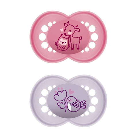 Two Mam Original Pure Silicone Pacifiers for babies 6 months and older in pink and purple, made by Jag Couture London New York.