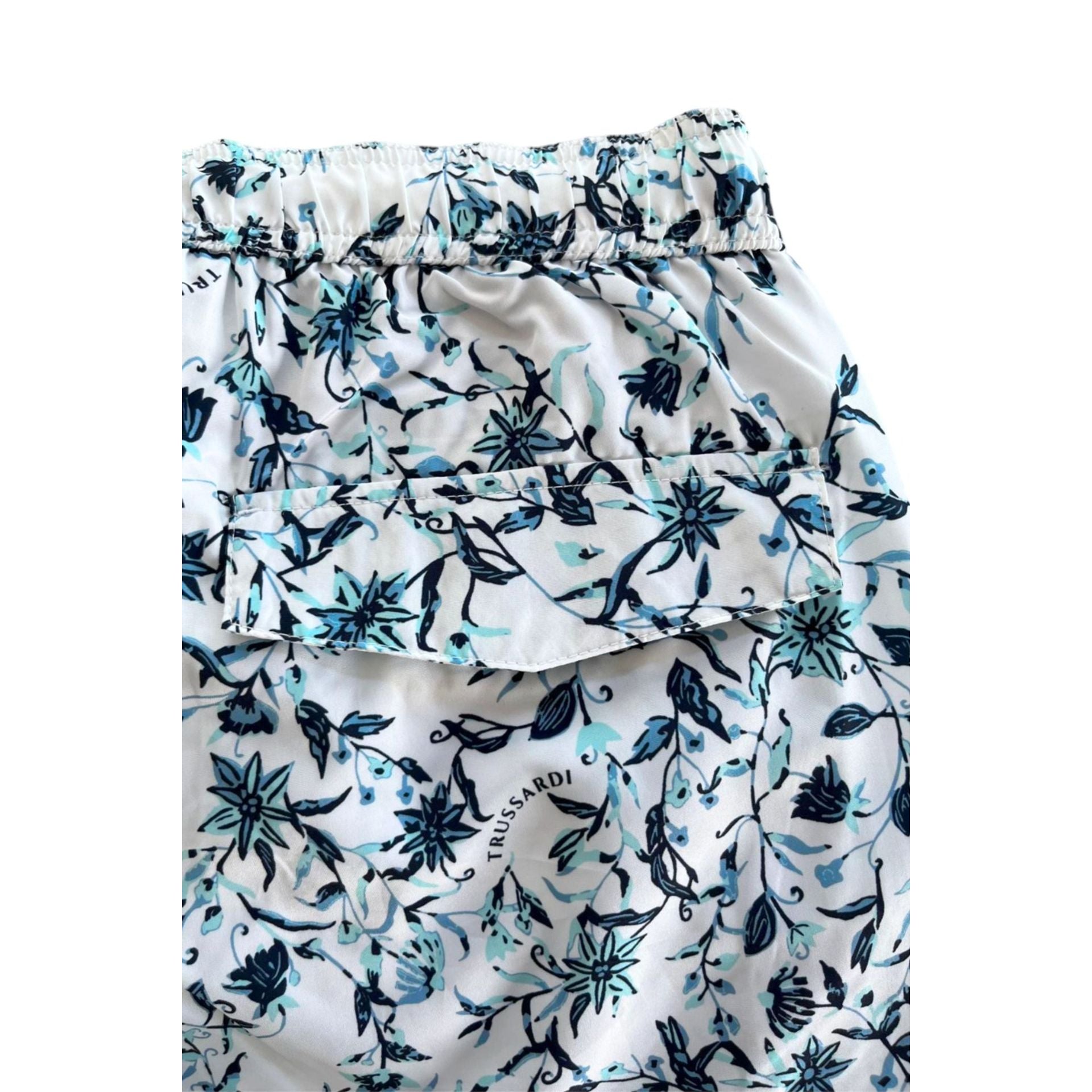 Trussardi beachwear TRU25MBM09 white swimsuit with sleek design, displayed on a mannequin for summer beach fashion.