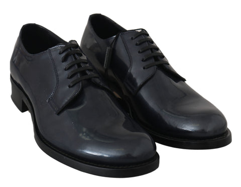 Blue leather Derby dress shoes by Dolce & Gabbana, featuring sleek design and polished finish on a formal footwear display.