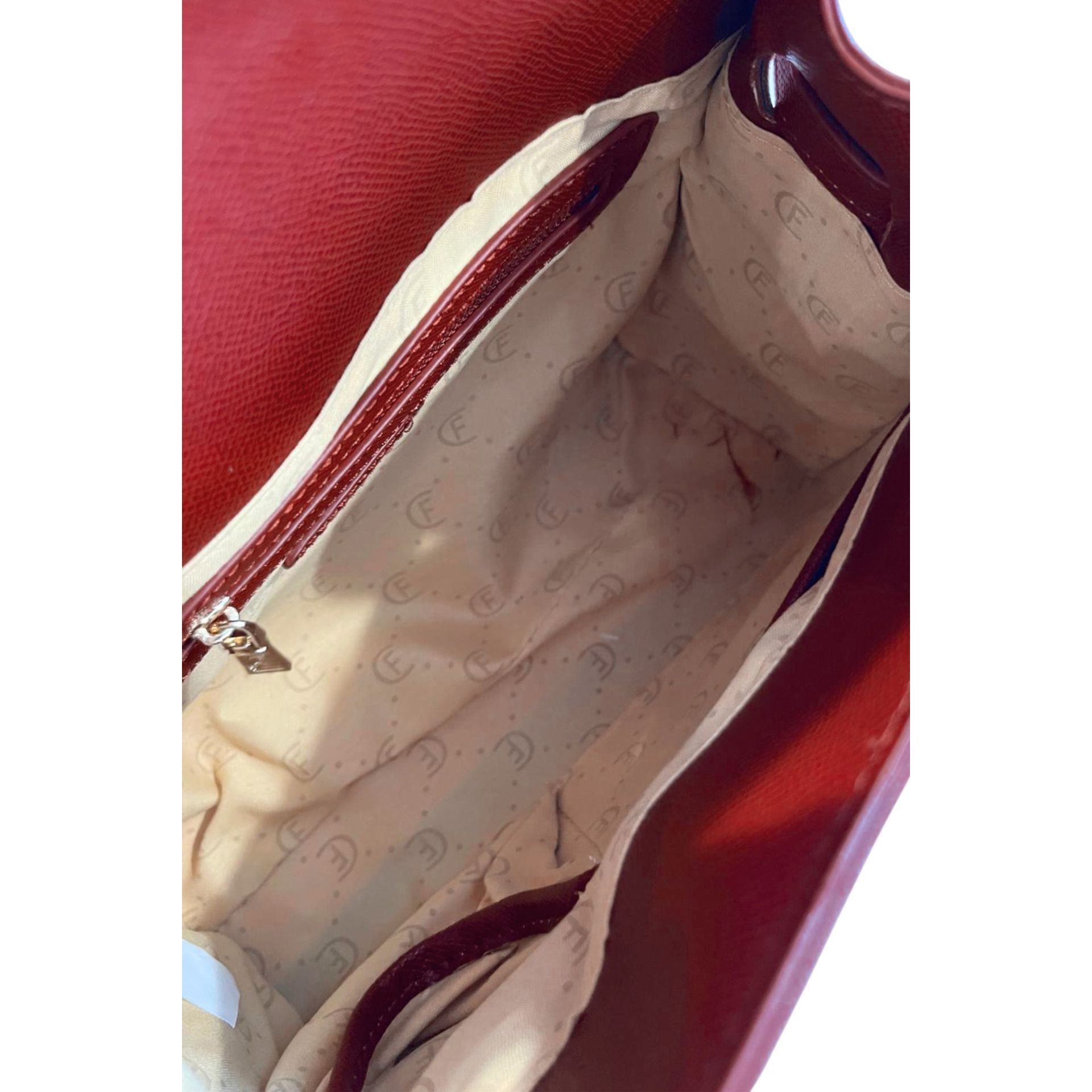 Cristinaeffe CF24FW027 Bordeaux leather handbag by Jag Couture London New York, showing the front view with textured surface.