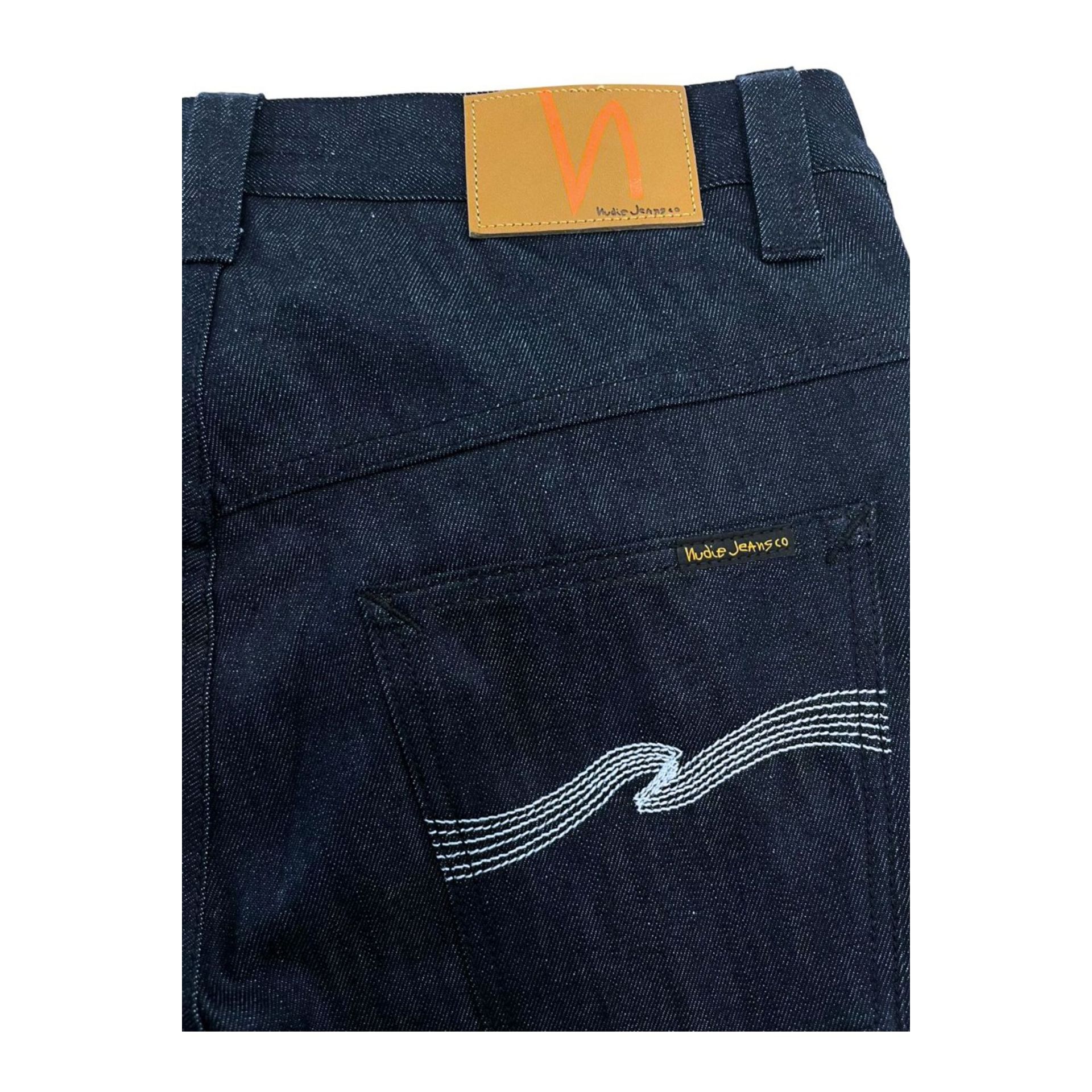 Nudie Jeans NJ3277 ThinFinn blue navy slim-fit denim jeans displayed on a mannequin with pockets and stitching details.