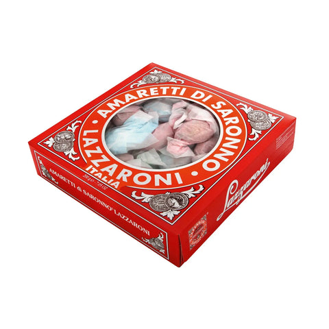 Box of Amaretti di Saronno biscuits by Jag Couture London New York, showcasing golden almond cookies in a clear box.