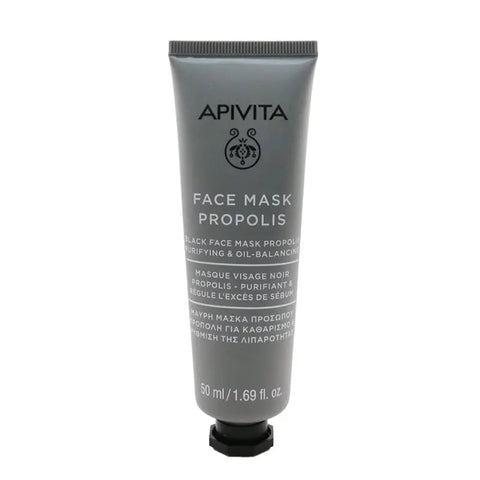 Apivita Black Face Mask with Propolis in a 50ml jar, shown on a clean surface with natural ingredients in the background.