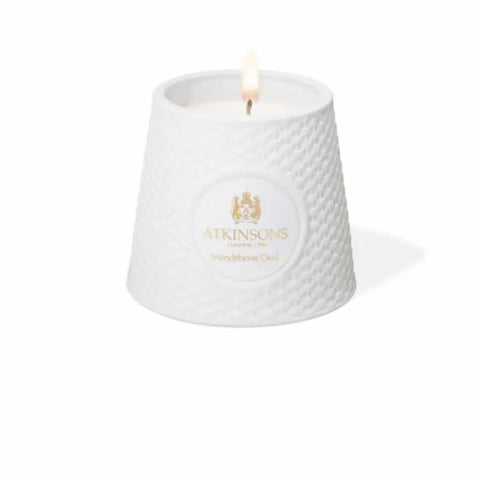 Atkinsons Marylebone Oud scented candle in 200g jar, showcasing elegant packaging and warm candle wax inside.