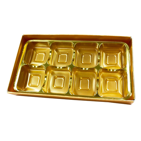 Gold chocolate base, gold vacuum tray, and cello lid from Jag Couture London - New York, arranged in a box.