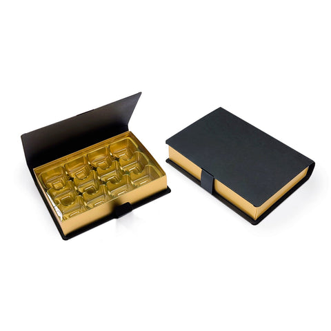 Jag Couture London - New York 12-pack hinged lid chocolate book boxes with gold vacuum tray, measuring 157 x 110 x 32 mm.