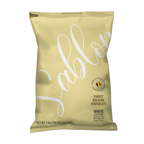 Jag Couture London - New York Sablon 30% white chocolate in a bag, showcasing smooth white chocolate pieces on a white background.