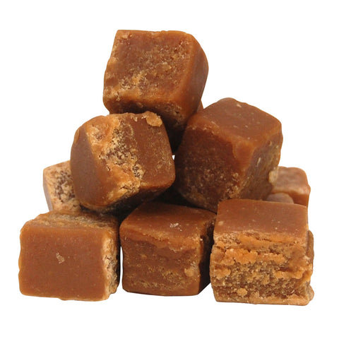 Hand-broken cubes of flavored butter fudge from Jag Couture London New York, showcasing rich, creamy texture and vibrant colors.