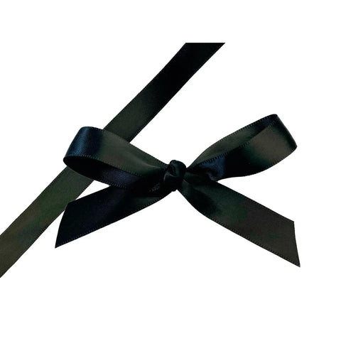 Black single-faced satin ribbon by Jag Couture London New York, showing smooth, shiny fabric with a satin finish.