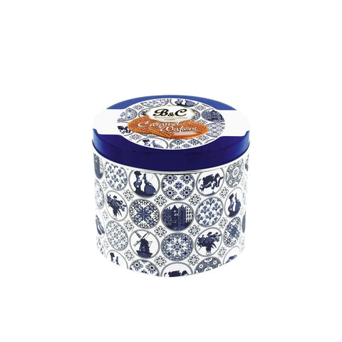 Blue and white tin of caramel wafers by Jag Couture London New York, with visible caramel wafers inside the tin.