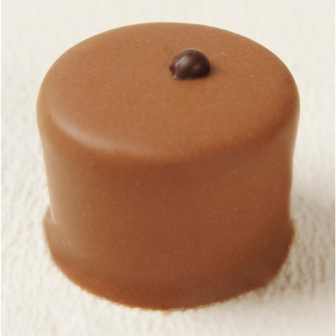 Tosca light crème brûlée mousse in milk chocolate, 19g by Jag Couture London - New York, showcasing the mousse's smooth texture and rich flavor.