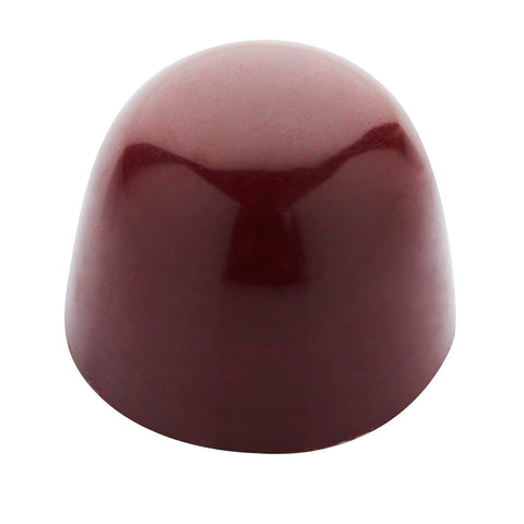Cherry sour cherry ganache with Morello cherry pulp in dark chocolate by Jag Couture London New York, shown in a 12.4g piece.