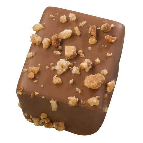Jag Couture London milk chocolate praline with caramelized nuts in a 17.7g bar, showcasing rich chocolate and crunchy nuts.