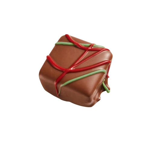 Carol salted caramel ganache in milk chocolate, 11.5g, by Jag Couture London New York, showing a smooth caramel filling inside a milk chocolate shell.