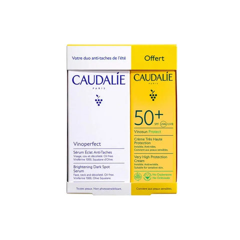 Two bottles of Caudalie Vinoperfect Anti-Dark Spot Radiance Serum 30ml set, featuring clear glass bottles with white caps.