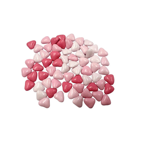 Milk chocolate hearts covered in pink sugar from Jag Couture London, New York, with a smooth, glossy surface and pink sugary coating.