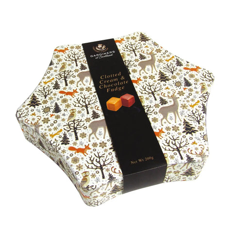 Christmas star tin filled with clotted cream and chocolate fudge, featuring festive holiday packaging by Jag Couture London New York