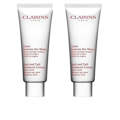 Clarins Crema Juventud De Manos hand cream in two 100ml tubes, displayed with packaging, by Jag Couture London - New York.