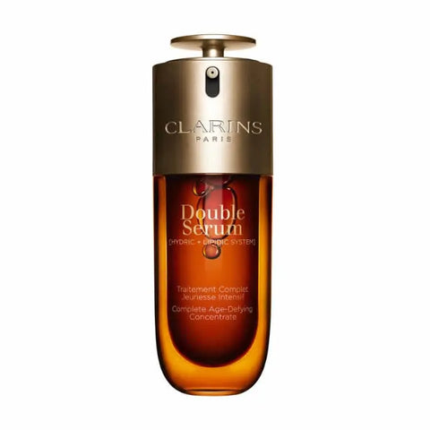 Clarins Double Serum 50ml in sleek bottle, displayed with branding from Jag Couture London New York, on a neutral background.